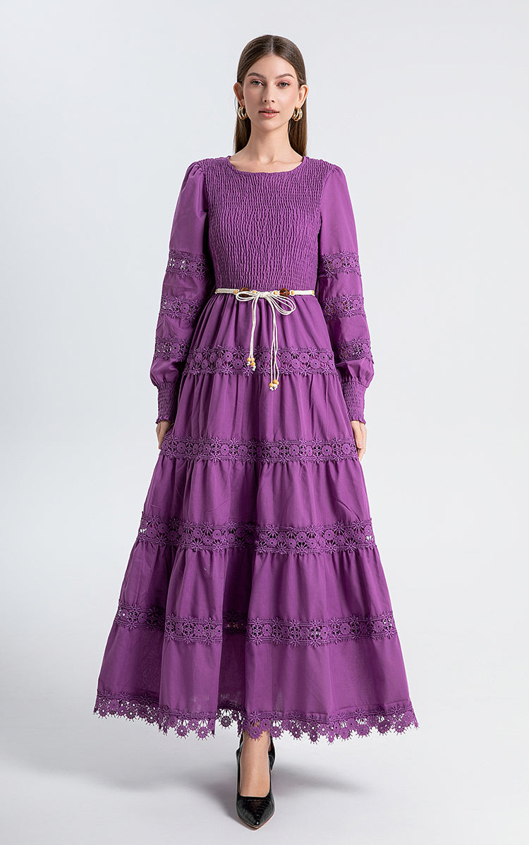 The French vintage maxi skirt is cut-out and laced in a solid color, cinching the waist and showing a slim round neck, lace panels