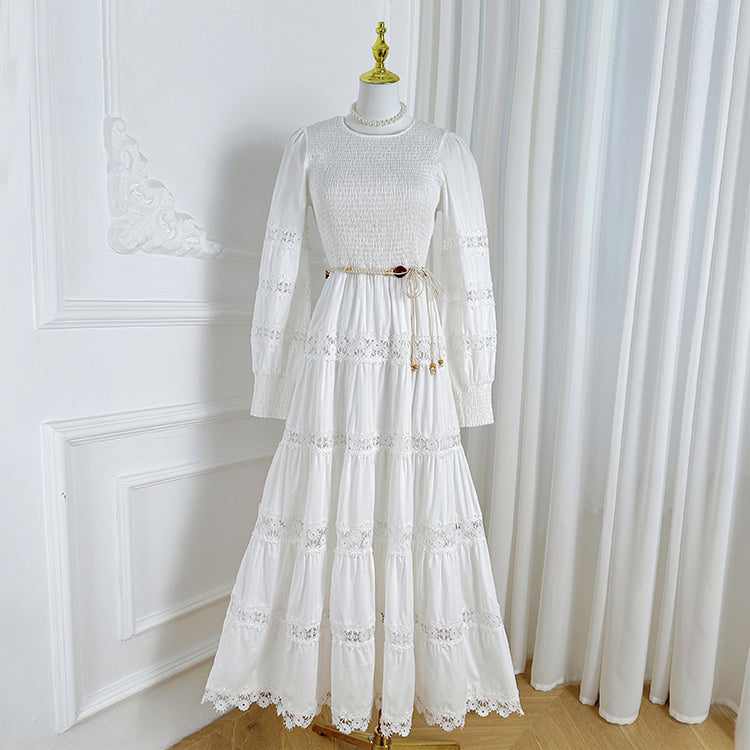 The French vintage maxi skirt is cut-out and laced in a solid color, cinching the waist and showing a slim round neck, lace panels